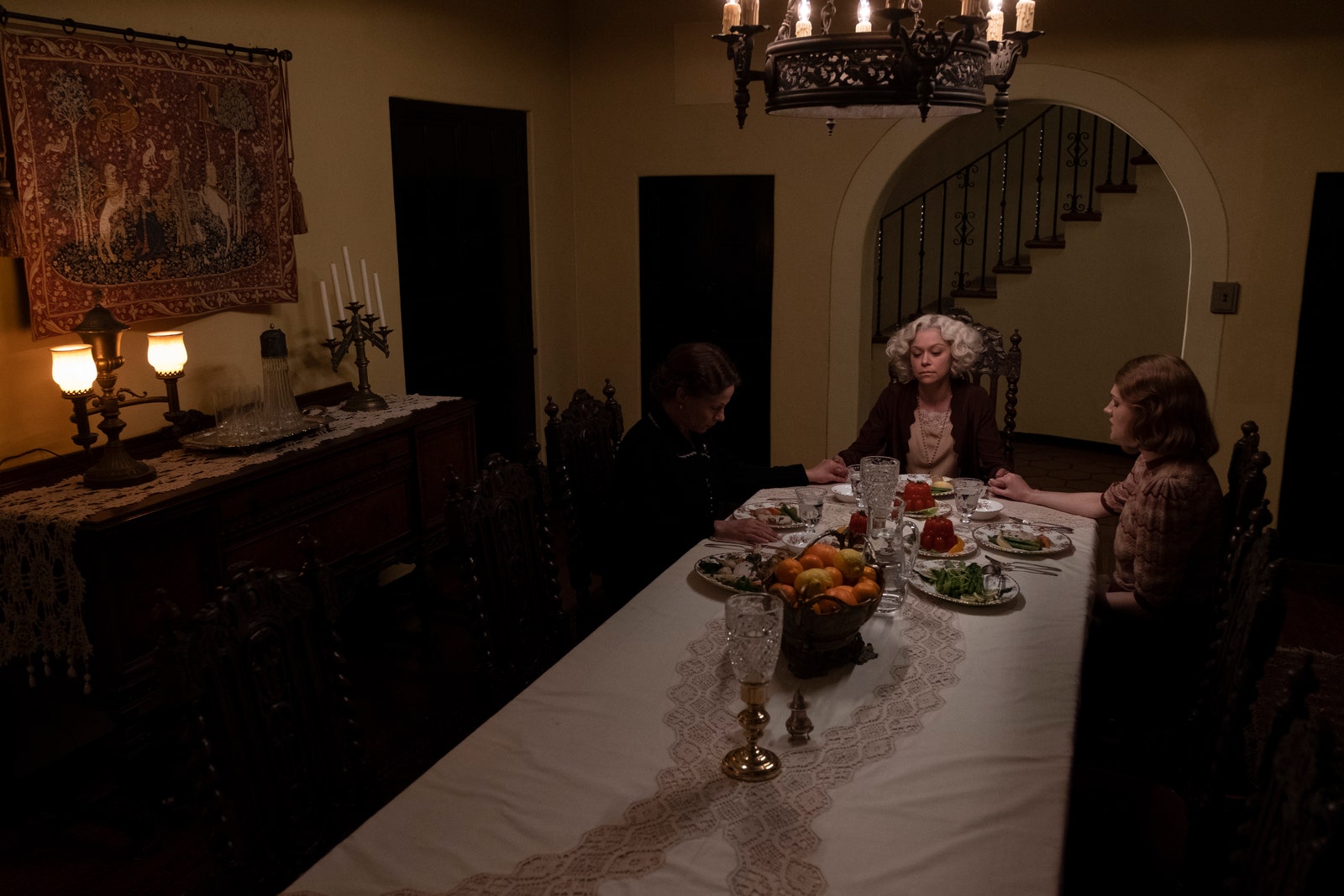 two women sitting at a dining room table